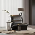 Modern Black Leather Leisure Chair With Side Table Green Plant And Magazine On Rug