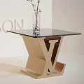 Modern Side Tables with X Shaped Golden Base Black Glass Top and Green Plant