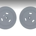 Automotive Flywheel Components Two Gray Toothed Wheels With Central Holes And Small Perforations