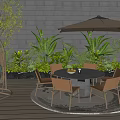 Outdoor Table And Chairs Set With Umbrella On Wooden Deck Surrounded By Green Plants