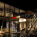 Modern Container Building Cafe Design With Outdoor Terrace Tables Chairs And Lighting