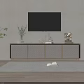 Modern TV Stand With Wall Mounted TV Decorative Items And Green Plants On Wooden Floor
