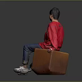 Man Wearing Red Love Me Sweater Sitting on Brown Trunk Blue Jeans White Sneakers