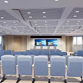 School Modern Auditorium With Blue Seats Large Screens And Ceiling Lights