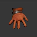 Orange Leather Glove With Brown Belt Buckle And Smooth Surface Texture