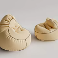Two Beige Comfortable Rounded Fabric Bean Bag Chairs for Home Use