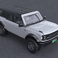 Silver Ford Bronco SUV With Large Off Road Tires And Modern Front Design