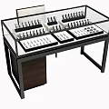Jewelry Store Glass Display Counter With Rings Necklaces Earrings And Organized Setup