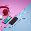 Smartphones With Red Over Ear Headphones White Earphones Charger And Data Cables On Colorful Background