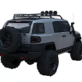 Gray Off-road Vehicle With Large Tires Roof Rack Spotlights And Front Design
