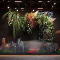 Indoor Landscape Design With Hanging Greenery Decorative Stones And Ambient Lighting Fixtures