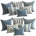 Various Blue And White Decorative Pillows Featuring Leaf And Geometric Patterns