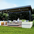 Modern Garden Pavilion with Black Roof and Wooden Deck Surrounded by Green Grass and Trees