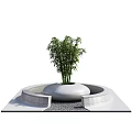 Park Landscape Featuring Circular Planter With Bamboo Plant And Gray Gravel Square Platform