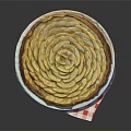 Homemade Apple Pie with Spiral Arranged Apple Slices on White Plate and Red Checkered Napkin
