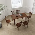 Wooden Dining Table Set With 6 Chairs And Green Plant In Bright Room