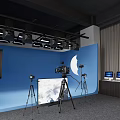 Professional Studio Setup With Blue Backdrop Cameras On Tripods Lighting And Monitors 3d model