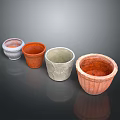 Set of Four Colorful Decorative Flower Pots with Textured Surfaces and Assorted Colors