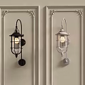 Classic Black and Silver Wall Lamps Mounted on Beige Wall With Ornate Frames Elegantly Lit