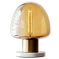 Modern Table Lamp With Transparent Glass Shade And Brass Base Illuminating Warm Light