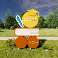 Space City College Billboard with Graduation Cap Book Entrance Sign in Outdoor Grassland Trees