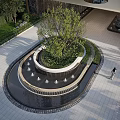Modern Water Feature Fountain With Central Tree And Surrounding Greenery In Paved Outdoor Landscape