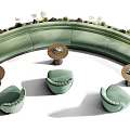 Modern Curved Green Public Chairs With Small Tables And Plants In Outdoor Area