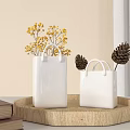 White Square Vases With Handle Holding Yellow Flowers On Wooden Tray With Pinecones And Books