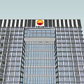 Modern Tall Office Building Featuring Glass Curtain Wall Greenery And Parking Area