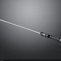 Long White Rod Tool With Black And Silver Striped End Design