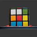 Rubik's Cube Shaped Birthday Cake With Colorful Squares Red Ribbon And Happy Birthday Message