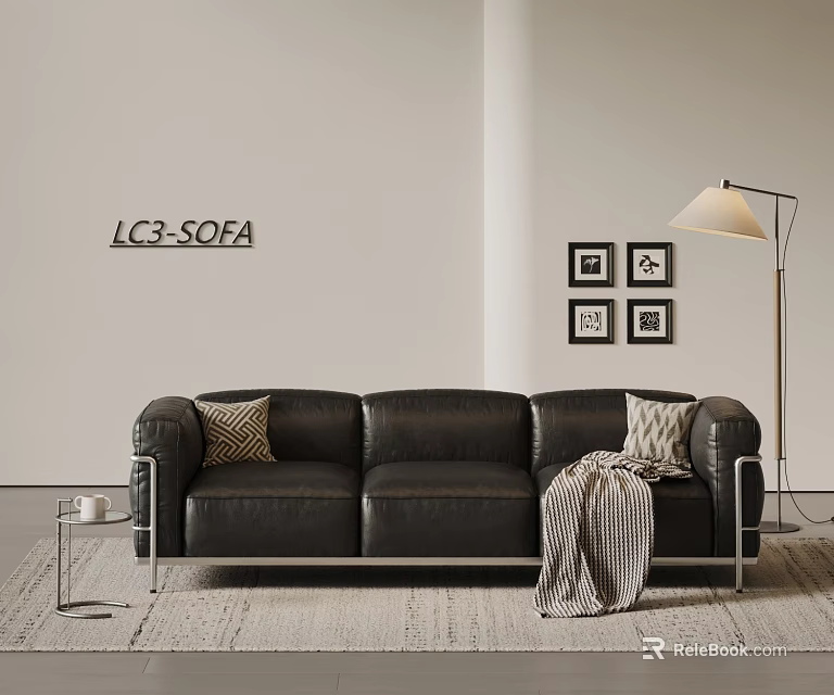 Black Leather Three Seater Sofa With Accent Pillows Striped Throw Blanket Floor Lamp And Wall Art 3d model 