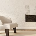 Beige Accent Chair With Wooden Legs By Abstract Painting On Textured Wall And Wooden Floor