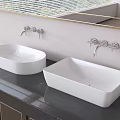 White Above Counter Bathroom Washbasins On Dark Countertop With Wall Mounted Faucets And Mirror