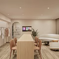 Modern Clothing Store Interior With Clothes Racks Long Wooden Table Chairs Sofa TV And Plant