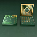 Perfume Cosmetics Elegant Green Luxury Packaging with Gold Accents Opened Box Containing Arranged Small Bottles