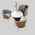 Elegant Table Chair Set With Marble Tabletop Gray Brown Upholstered Cushions Gold Legs and Plant