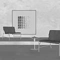 Modern Black And Gray Accent Chairs With Abstract Artwork On Gray Wall And Small Table