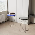 Modern Round Stools With Blue And Black Tops And Metal Frames In Room Corner