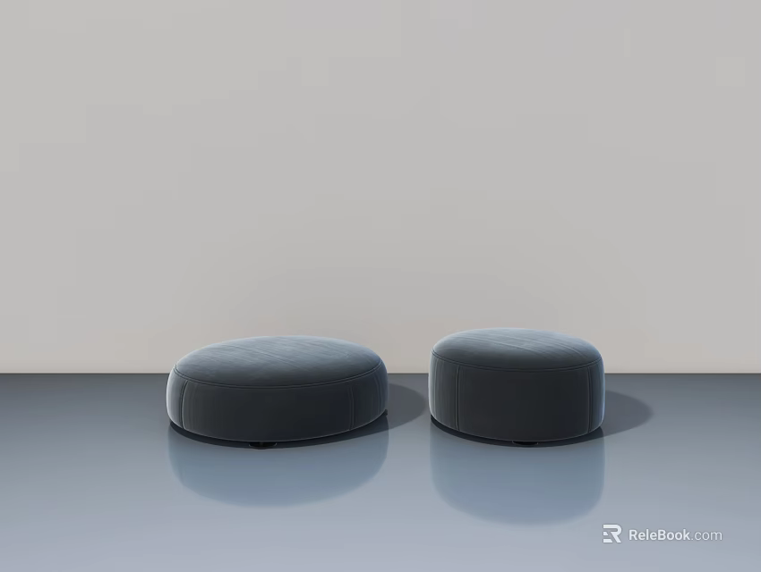 Gray Round Upholstered Ottomans Placed On Smooth Floor With Light Wall Background 3d model 