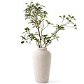 White Textured Vase With Green Leafy Branches For Minimalist Home Decor