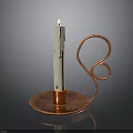 Decorative Copper Candlestick Holder With Curved Design And Lit White Candle