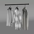 Three Different Patterned Coats Hanging On Metal Rod In Minimalist Space