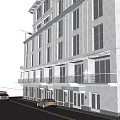 Commercial Street Featuring Multi Story Building Ground Floor Shops Balconies And Street Cars