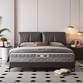 Gray Leather Double Bed with Bedside Table Lamp and Green Plant on Checkered Floor
