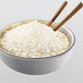 White Bowl Filled With Cooked Rice And Wooden Chopsticks Inside
