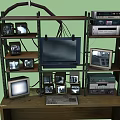 Vintage Daily Electrical Appliances Display on Wooden Shelves with Old TVs Radios and Computers