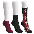 Colorful Stylish Socks On White Mannequin Legs Featuring Red Black Glittery And Patterned Designs