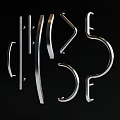 Silver Metal Door Handles With Various Curved And Straight Designs On Black Background