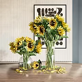Bright Yellow Sunflowers In Glass Vases With Scattered Petals On Table And Decorative Wall